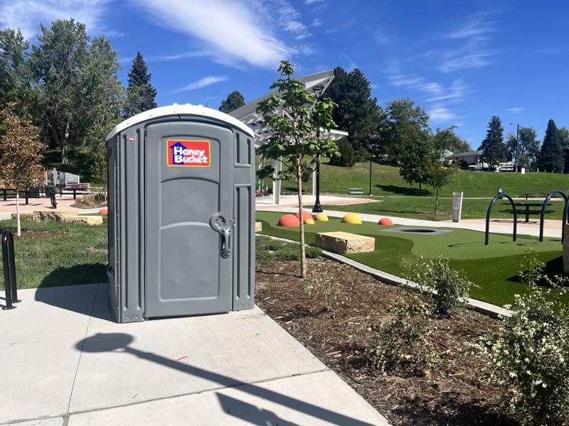 An accessible porta potty installed in Joe P. Martinez Park in Villa Park, Denver
